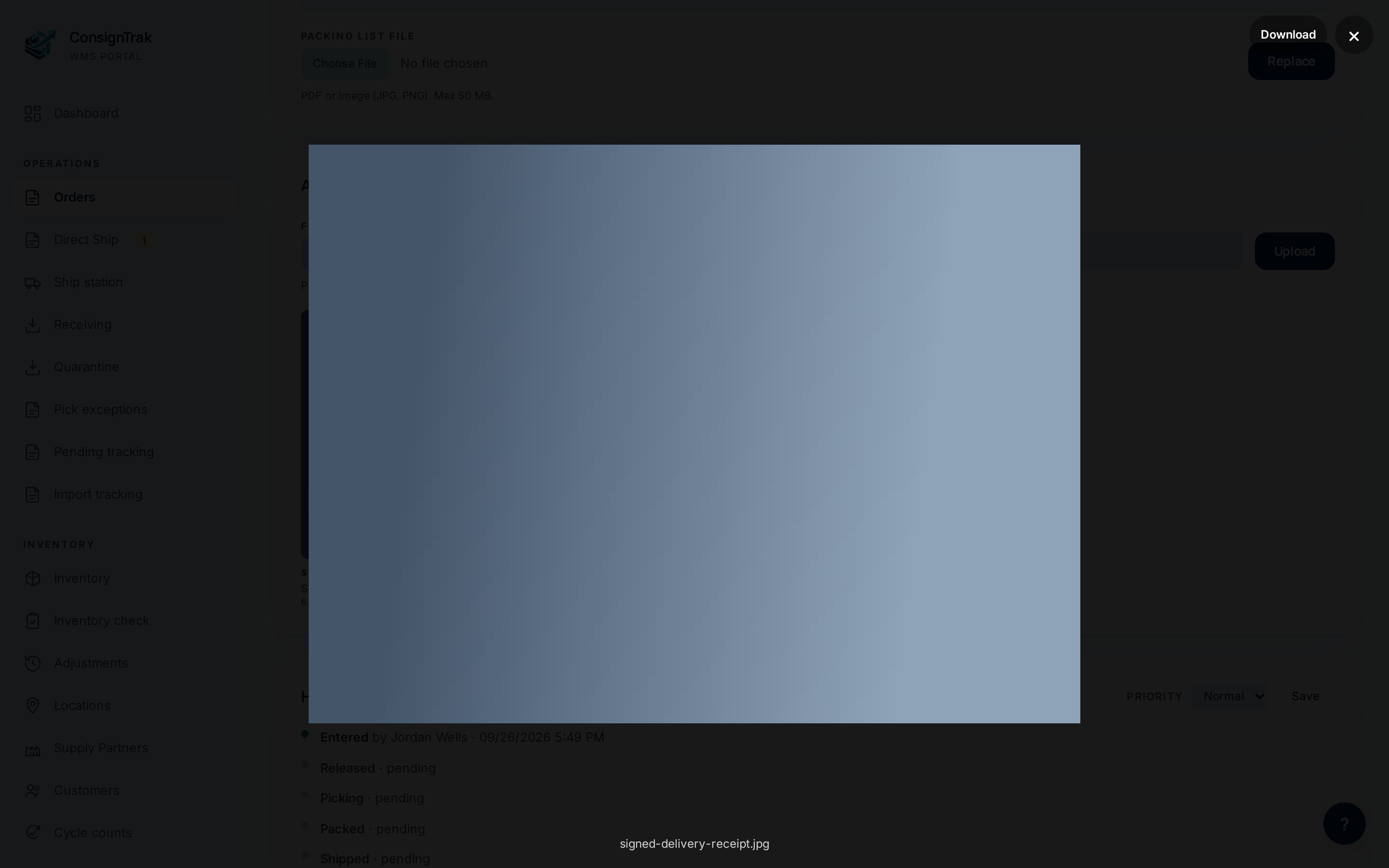 A photo attachment open full size in the viewer, with Download and close buttons