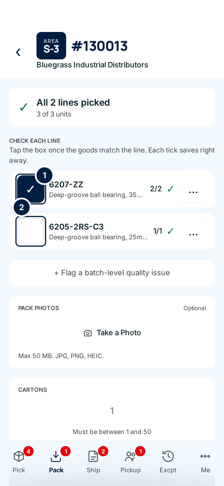 The pack screen on a phone for an order in area S-3: the first line ticked, the second not yet