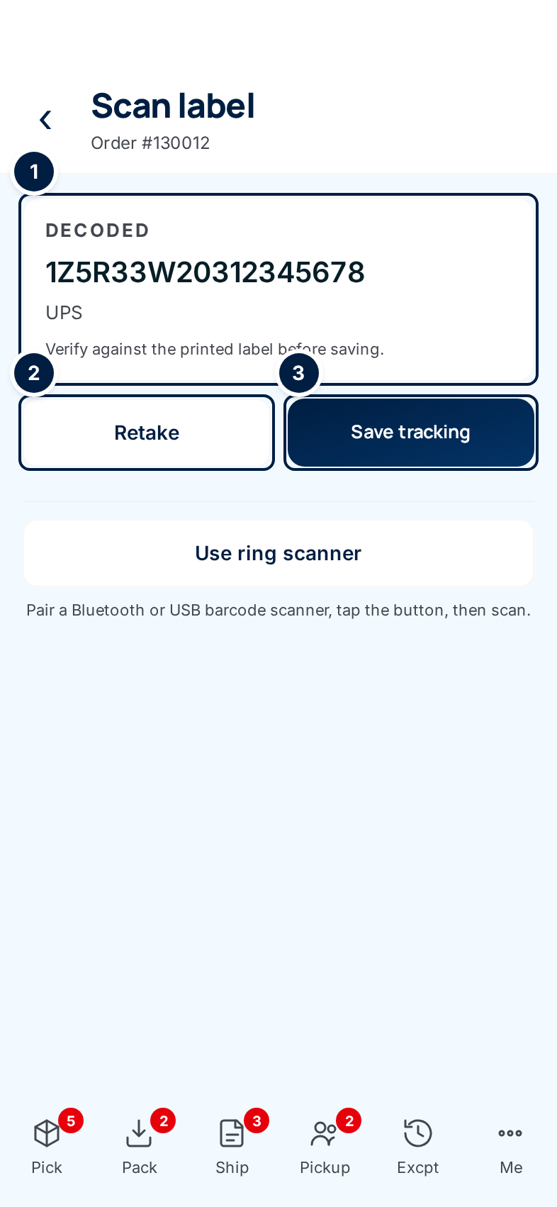 The Scan label screen after a read: the decoded tracking number and UPS, with Retake and Save tracking